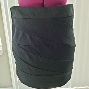 Mini skirt. Picture doesn't do it justice.. super cute on! Size 0